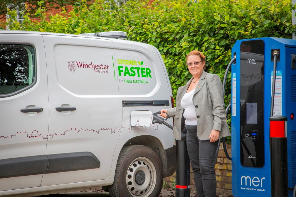 Councillor Learney using one of the new rapid EV chargers.